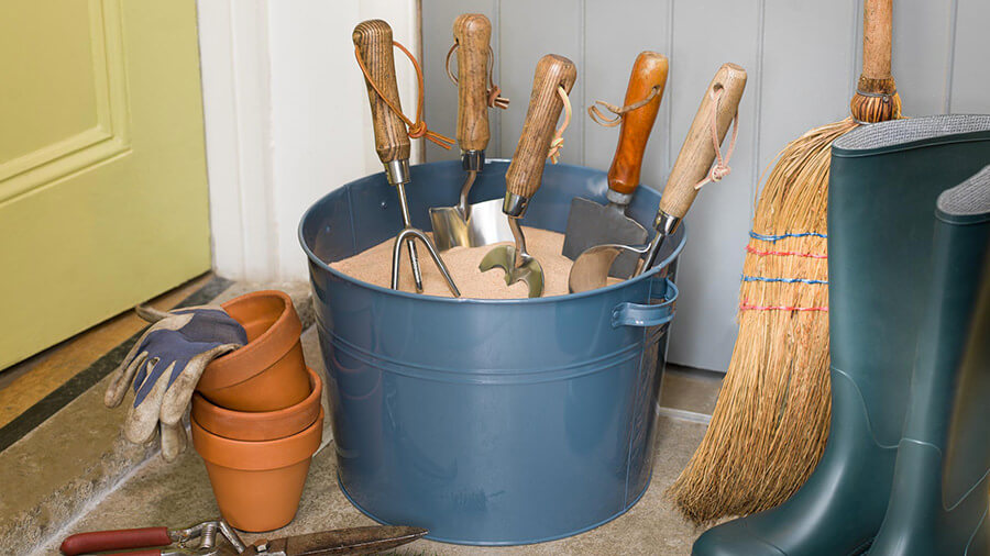 gardening tools in sand